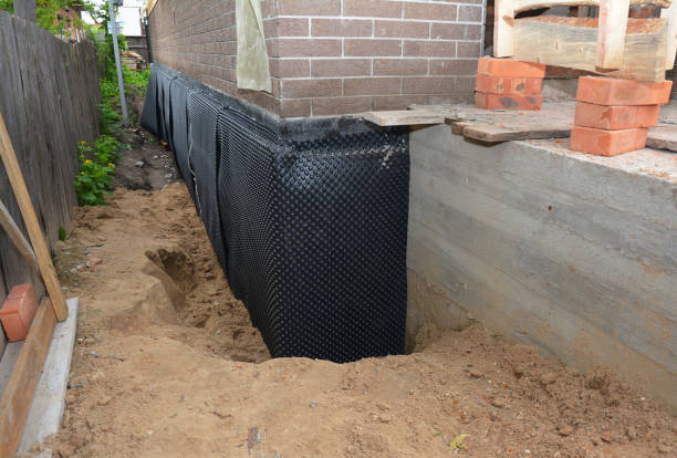 Happy homeowners after waterproofing job in Port Clinton